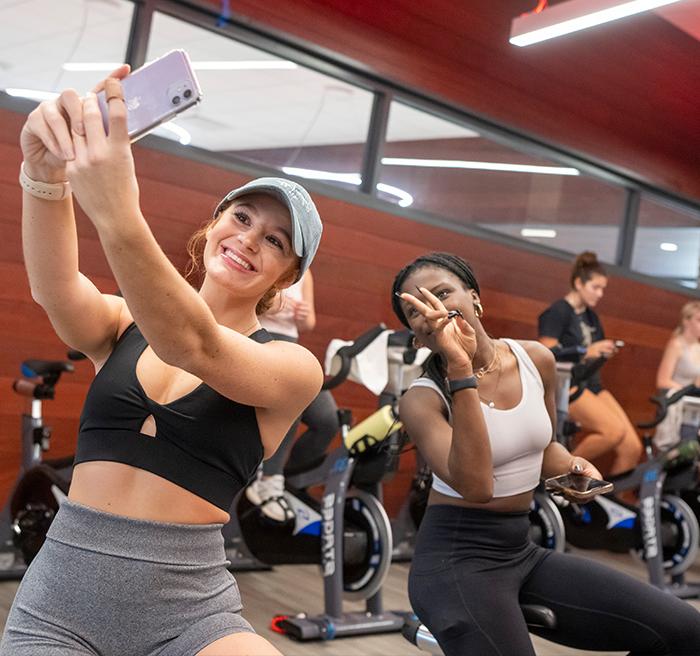 Students take a selfie in a group fitness class.